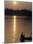 Man on Boat on River Near Dr. Albert Schweitzer's Compound at Lambarene-George Silk-Mounted Photographic Print