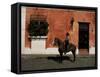 Man on Horse in Front of a Typical Painted Wall, Antigua, Guatemala, Central America-Upperhall-Framed Stretched Canvas