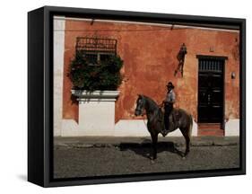 Man on Horse in Front of a Typical Painted Wall, Antigua, Guatemala, Central America-Upperhall-Framed Stretched Canvas