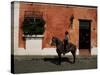 Man on Horse in Front of a Typical Painted Wall, Antigua, Guatemala, Central America-Upperhall-Stretched Canvas