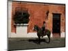 Man on Horse in Front of a Typical Painted Wall, Antigua, Guatemala, Central America-Upperhall-Mounted Photographic Print