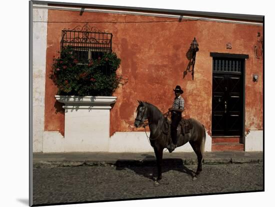 Man on Horse in Front of a Typical Painted Wall, Antigua, Guatemala, Central America-Upperhall-Mounted Photographic Print