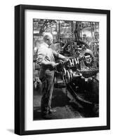 Man Operating Machinery in a Car Factory-null-Framed Photographic Print