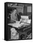 Man Operating Printing Press on Queen Elizabeth-Ed Clark-Framed Stretched Canvas