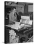 Man Operating Printing Press on Queen Elizabeth-Ed Clark-Stretched Canvas