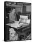 Man Operating Printing Press on Queen Elizabeth-Ed Clark-Framed Stretched Canvas