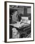 Man Operating Printing Press on Queen Elizabeth-Ed Clark-Framed Photographic Print