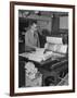 Man Operating Printing Press on Queen Elizabeth-Ed Clark-Framed Photographic Print