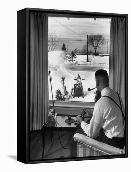 Man Operating Remote Control Snow Plow-Joe Scherschel-Framed Stretched Canvas