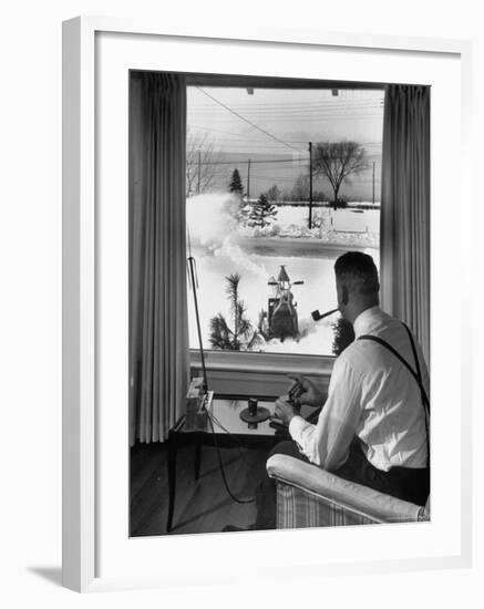 Man Operating Remote Control Snow Plow-Joe Scherschel-Framed Photographic Print