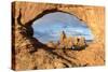 Man overlooking Turret Arch from North Window. Arches National Park, Moab, Grand County, Utah, USA.-ClickAlps-Stretched Canvas