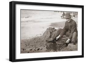 Man Panning Gold on Nome, Alaska, Beach in the Early 20th Century-null-Framed Photo