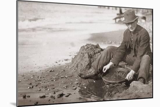 Man Panning Gold on Nome, Alaska, Beach in the Early 20th Century-null-Mounted Photo