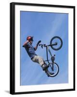 Man Performing Trick on a Bicycle-null-Framed Photographic Print