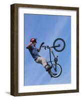 Man Performing Trick on a Bicycle-null-Framed Photographic Print