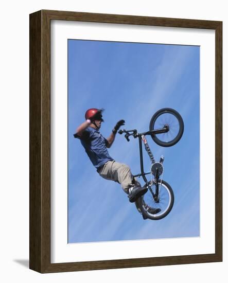 Man Performing Trick on a Bicycle-null-Framed Photographic Print