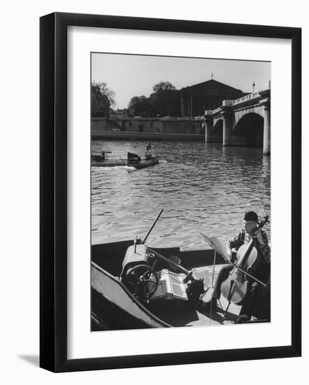 Man Playing Cello on Boat-Loomis Dean-Framed Photographic Print