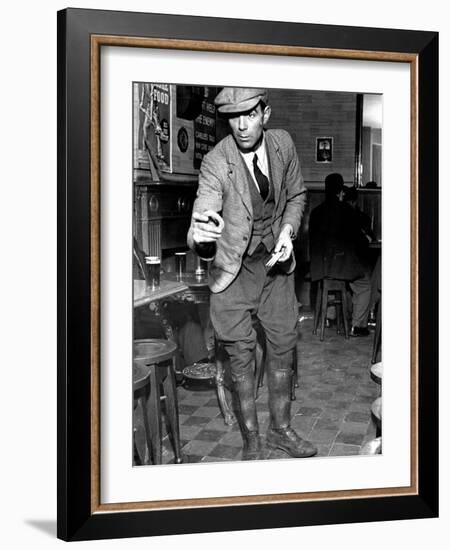 Man Playing Quoits, Like Horse Shoes, in an English Pub-Hans Wild-Framed Photographic Print