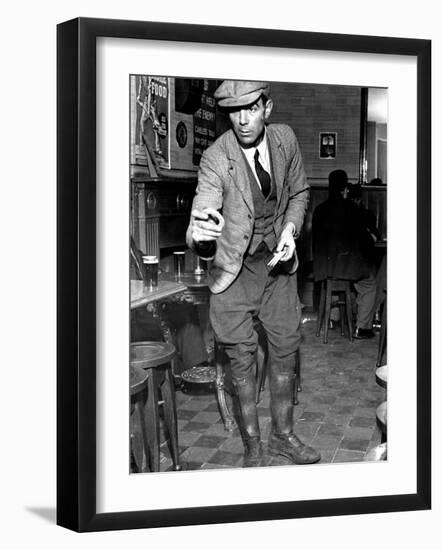 Man Playing Quoits, Like Horse Shoes, in an English Pub-Hans Wild-Framed Photographic Print