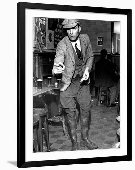 Man Playing Quoits, Like Horse Shoes, in an English Pub-Hans Wild-Framed Photographic Print