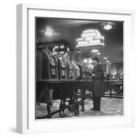 Man Playing the Slot Machines-Ralph Morse-Framed Photographic Print