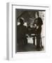 Man Plays a Piano and Looks up at a Glamorous Woman in a Long Dress-null-Framed Photographic Print