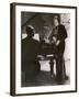 Man Plays a Piano and Looks up at a Glamorous Woman in a Long Dress-null-Framed Photographic Print