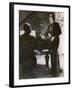 Man Plays a Piano and Looks up at a Glamorous Woman in a Long Dress-null-Framed Photographic Print