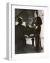 Man Plays a Piano and Looks up at a Glamorous Woman in a Long Dress-null-Framed Photographic Print