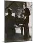 Man Plays a Piano and Looks up at a Glamorous Woman in a Long Dress-null-Mounted Photographic Print