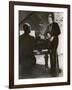 Man Plays a Piano and Looks up at a Glamorous Woman in a Long Dress-null-Framed Photographic Print