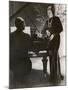 Man Plays a Piano and Looks up at a Glamorous Woman in a Long Dress-null-Mounted Photographic Print