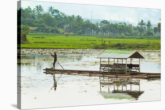 Man Punting Bamboo Raft on Situ Cangkuang Lake at This Village known for its Temple-Rob-Stretched Canvas