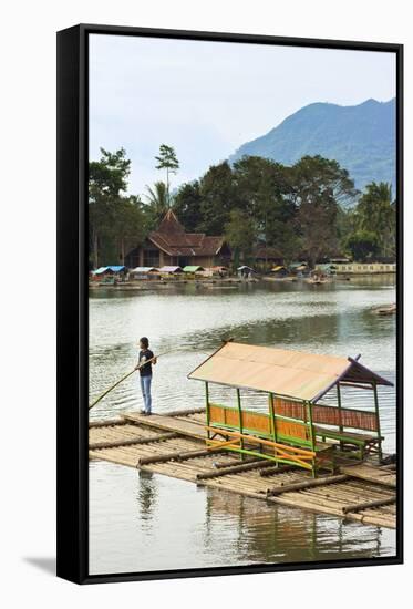Man Punting Bamboo Raft on Situ Cangkuang Lake at This Village known for its Temple-Rob-Framed Stretched Canvas