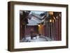 Man pushing bicycle along alleyway, Lijiang (UNESCO World Heritage Site), Yunnan, China-Ian Trower-Framed Photographic Print