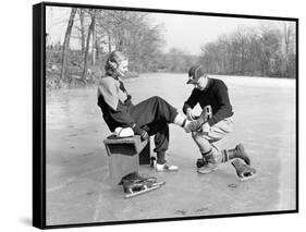 Man Putting on Woman's Ice Skates-Philip Gendreau-Framed Stretched Canvas