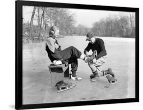 Man Putting on Woman's Ice Skates-Philip Gendreau-Framed Photographic Print