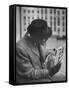 Man Reading a Newspaper While Wearing a Fedora Hat with a Flattened Top and Slim Brim-Ralph Morse-Framed Stretched Canvas