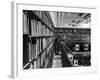 Man Reading Book Among Shelves on Balcony in New York Public Library-Alfred Eisenstaedt-Framed Photographic Print