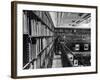 Man Reading Book Among Shelves on Balcony in New York Public Library-Alfred Eisenstaedt-Framed Photographic Print