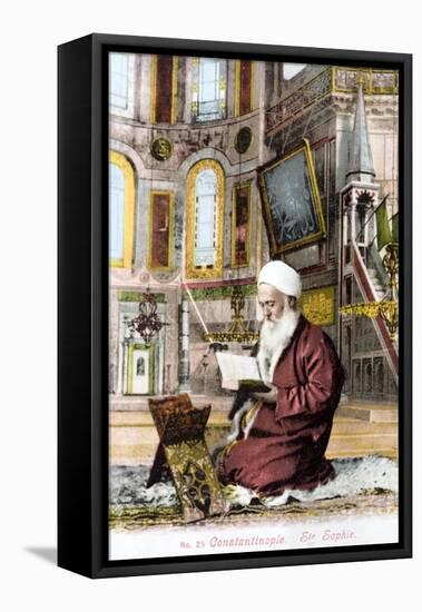 Man Reading Koran in Hagia Sofia-null-Framed Stretched Canvas