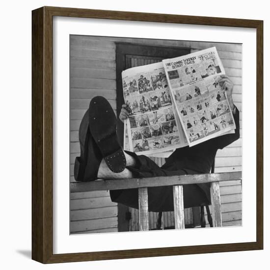 Man Reading the Comics Section of the Detroit Times on a Typical Sunday During WWII-Walter Sanders-Framed Photographic Print