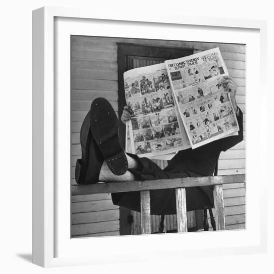 Man Reading the Comics Section of the Detroit Times on a Typical Sunday During WWII-Walter Sanders-Framed Photographic Print