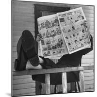 Man Reading the Comics Section of the Detroit Times on a Typical Sunday During WWII-Walter Sanders-Mounted Photographic Print