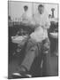 Man Receiving a Shave in a Barber Shop-Cornell Capa-Mounted Photographic Print