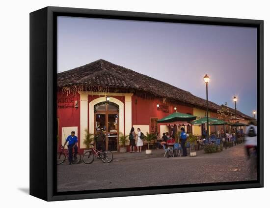 Man Rideing Bike Past Restaurant on Calle La Calzada, Granada, Nicaragua, Central America-Jane Sweeney-Framed Stretched Canvas