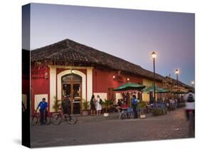Man Rideing Bike Past Restaurant on Calle La Calzada, Granada, Nicaragua, Central America-Jane Sweeney-Stretched Canvas