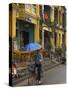 Man Riding a Bike and Holding Umbrella, Hoi An, Indochina-Eitan Simanor-Stretched Canvas