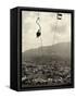 Man Riding Chair Lift Above Town-Jerry Cooke-Framed Stretched Canvas