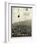 Man Riding Chair Lift Above Town-Jerry Cooke-Framed Photographic Print